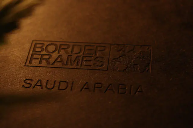 Engraved Borderframes logo and “Saudi Arabia” on a frame’s backplate