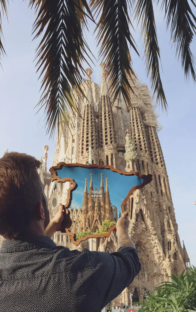 Spain Borderframe held up in front of the Sagrada Família in Barcelona